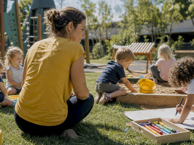 Educator observing toddlers playing in classroom