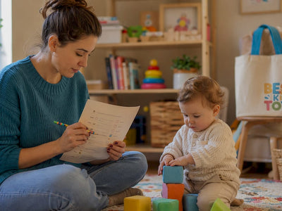 Mother reviewing child milestone checklist at home