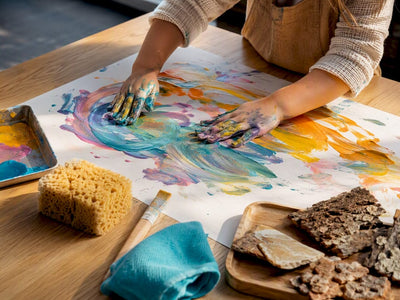 Child exploring paint in open-ended art