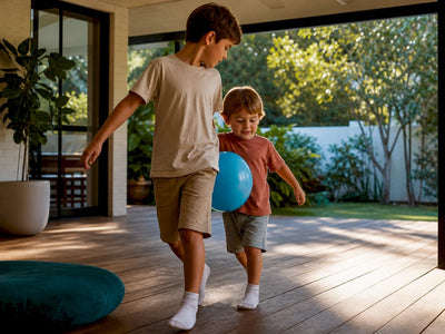 Siblings coordinating a balloon game together