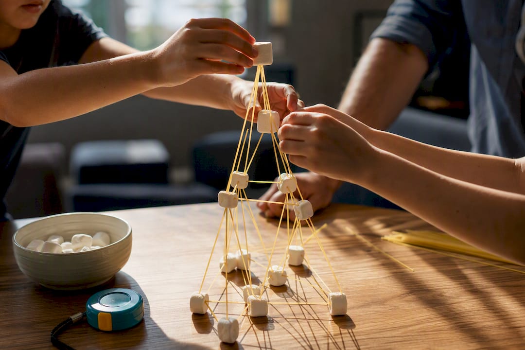 Children building a marshmallow STEM tower