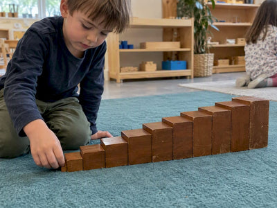 Brown wooden prisms assembled into a staircase