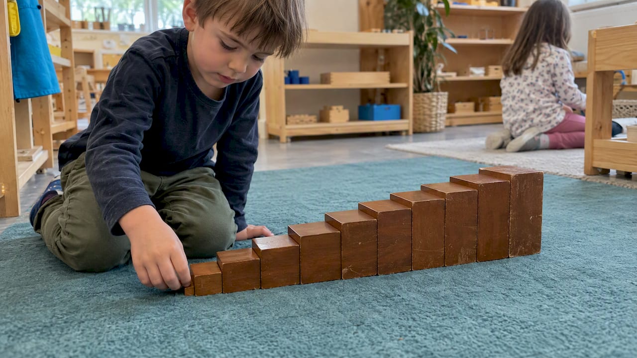 Brown wooden prisms assembled into a staircase