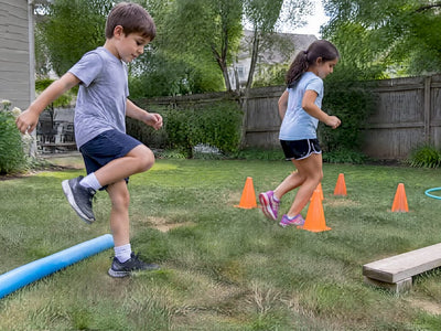 Children navigating a backyard obstacle course