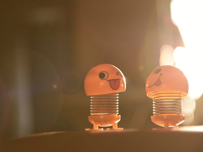 two blue and orange plastic toys
