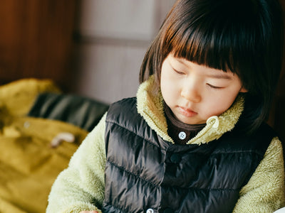 girl in black bubble jacket smiling