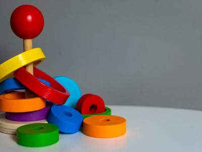 blue green yellow and red plastic toy