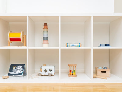 a shelf filled with lots of different types of toys