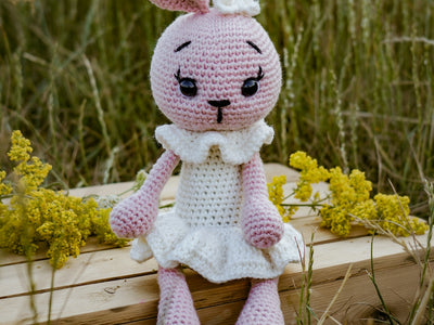 a stuffed animal on a branch