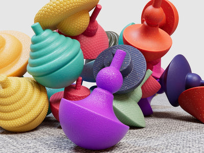 a pile of colorful toys sitting on top of a carpet