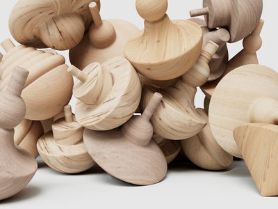 a pile of wooden toys sitting on top of a table
