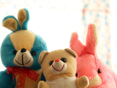 a couple of stuffed animals sitting next to each other