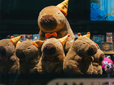 a group of stuffed animals sitting on top of a table