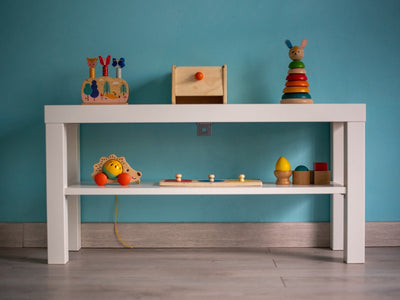 A white table with toys on top of it