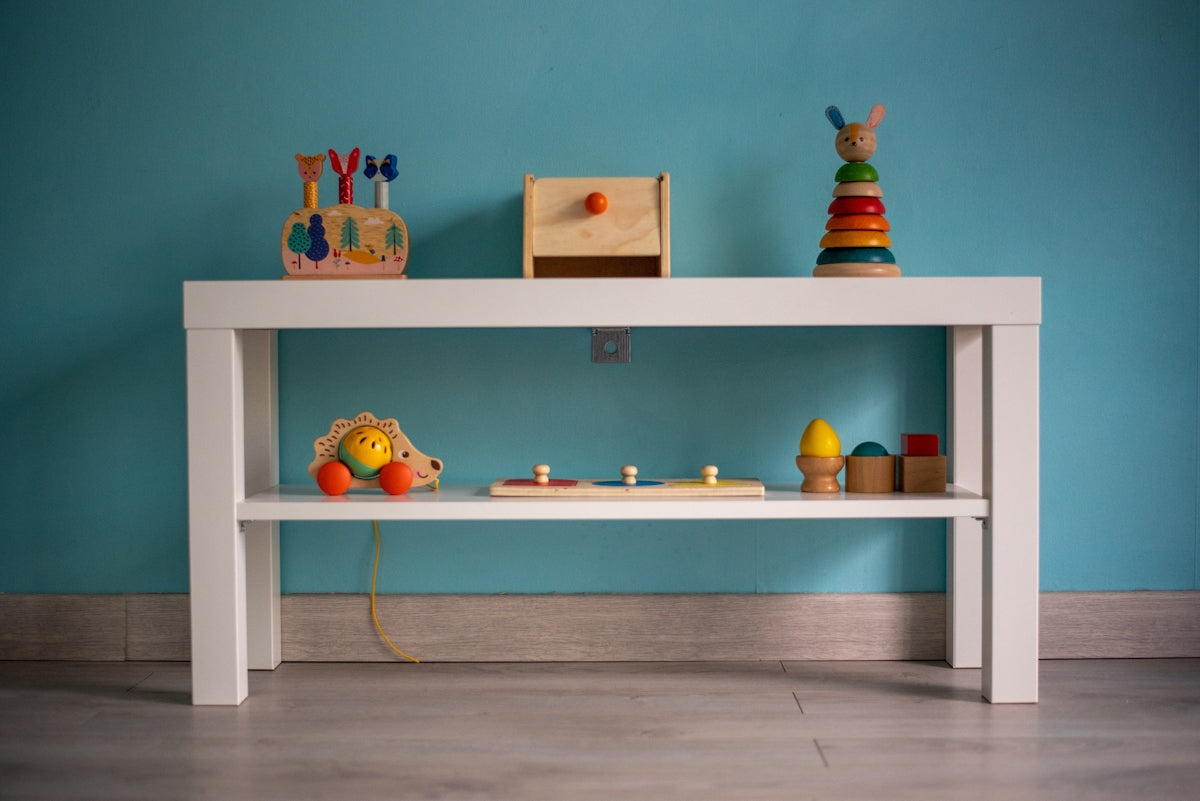 A white table with toys on top of it