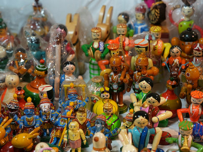 Collection of colorful wooden handmade dolls and toys