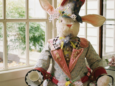 A whimsical easter bunny dressed in a colorful suit.