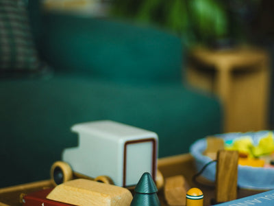 Wooden toys and books on a coffee table
