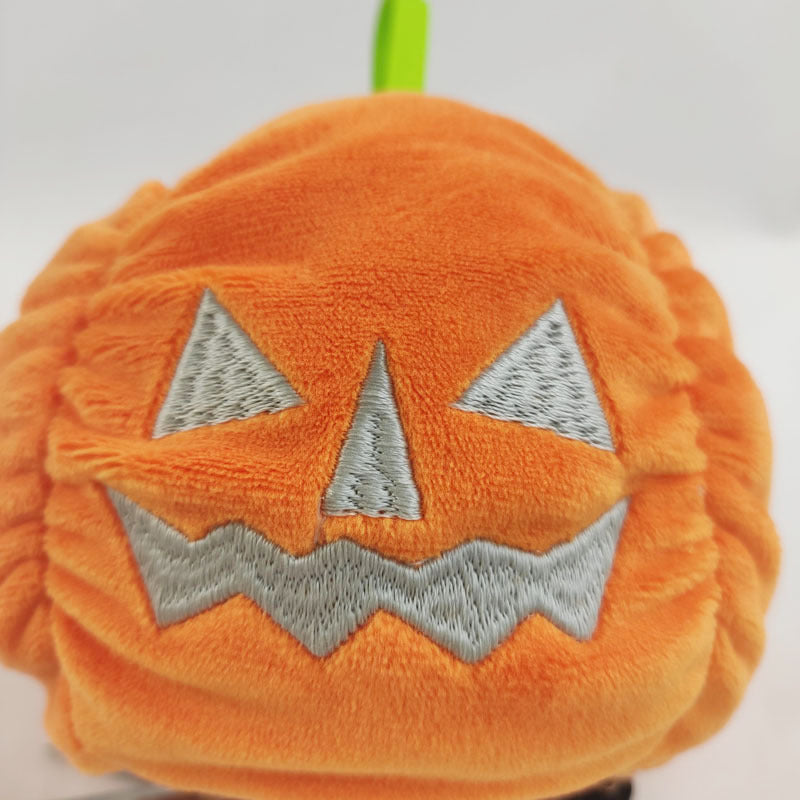 Reversible ghost plush flipped to grumpy side