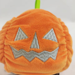 Reversible ghost plush flipped to grumpy side
