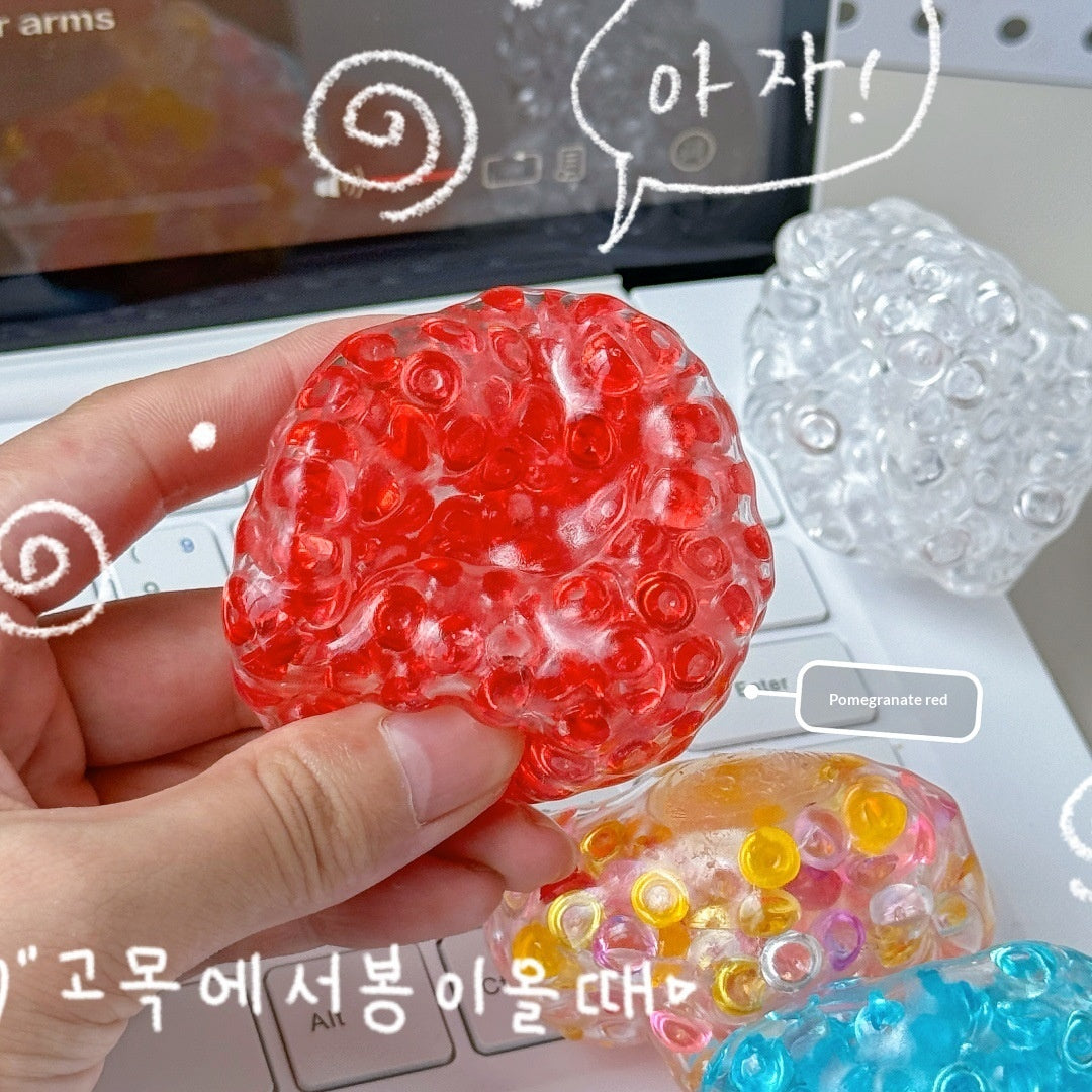 Squish ball being squeezed in the hand