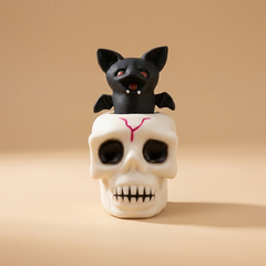 Halloween skull squeeze cup sensory fidget toy on a beige studio background