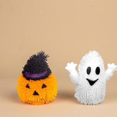 Glow Ghost Squeeze Ball light-up fidget toys on a beige studio background
