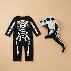 Kids skeleton costume on a beige studio background
