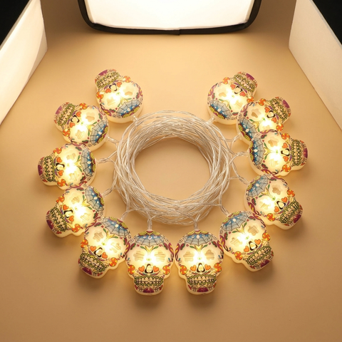 Halloween skull string lights on a beige studio background
