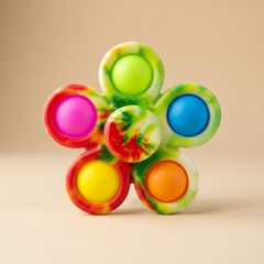 Printed fidget spinner on a beige studio background