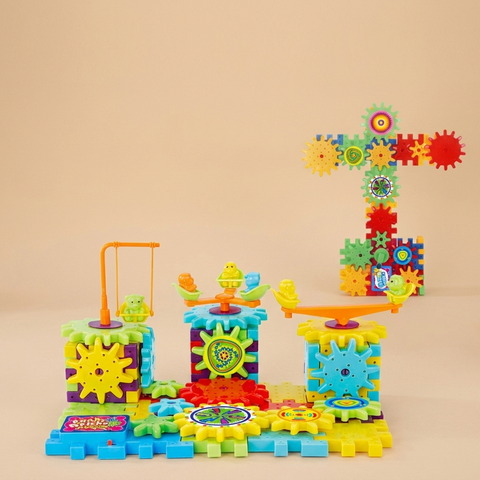 Electric gears STEM building set on a beige studio background
