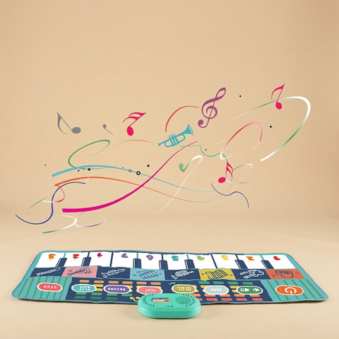 Baby musical crawling mat on a beige studio background