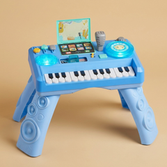 Baby DJ playset activity table on a beige studio background