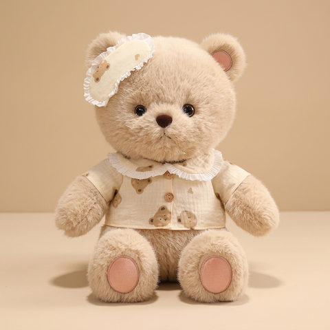 Good night bear plush on a beige studio background
