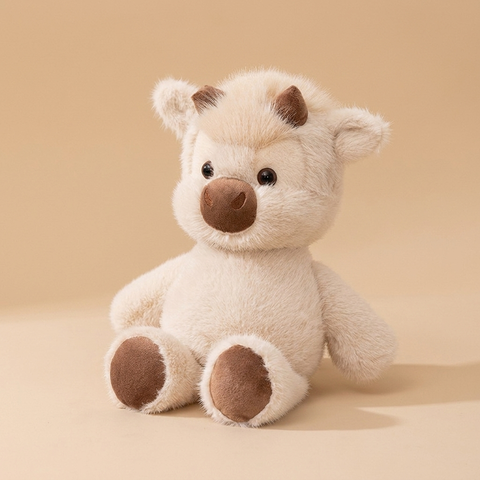 Little calf plush on a beige studio background