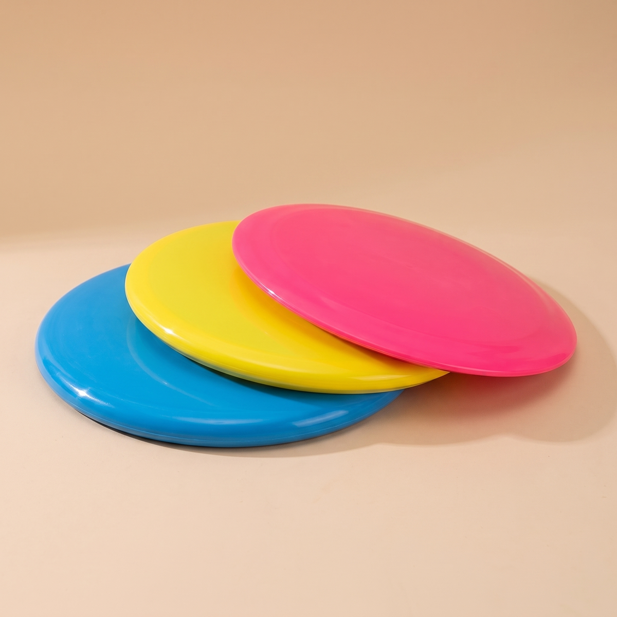 Disc golf frisbee set fanned out showing putter, midrange and driver profiles
