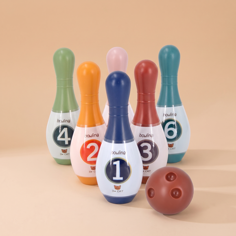 Children's indoor bowling set with plastic pins and brown ball