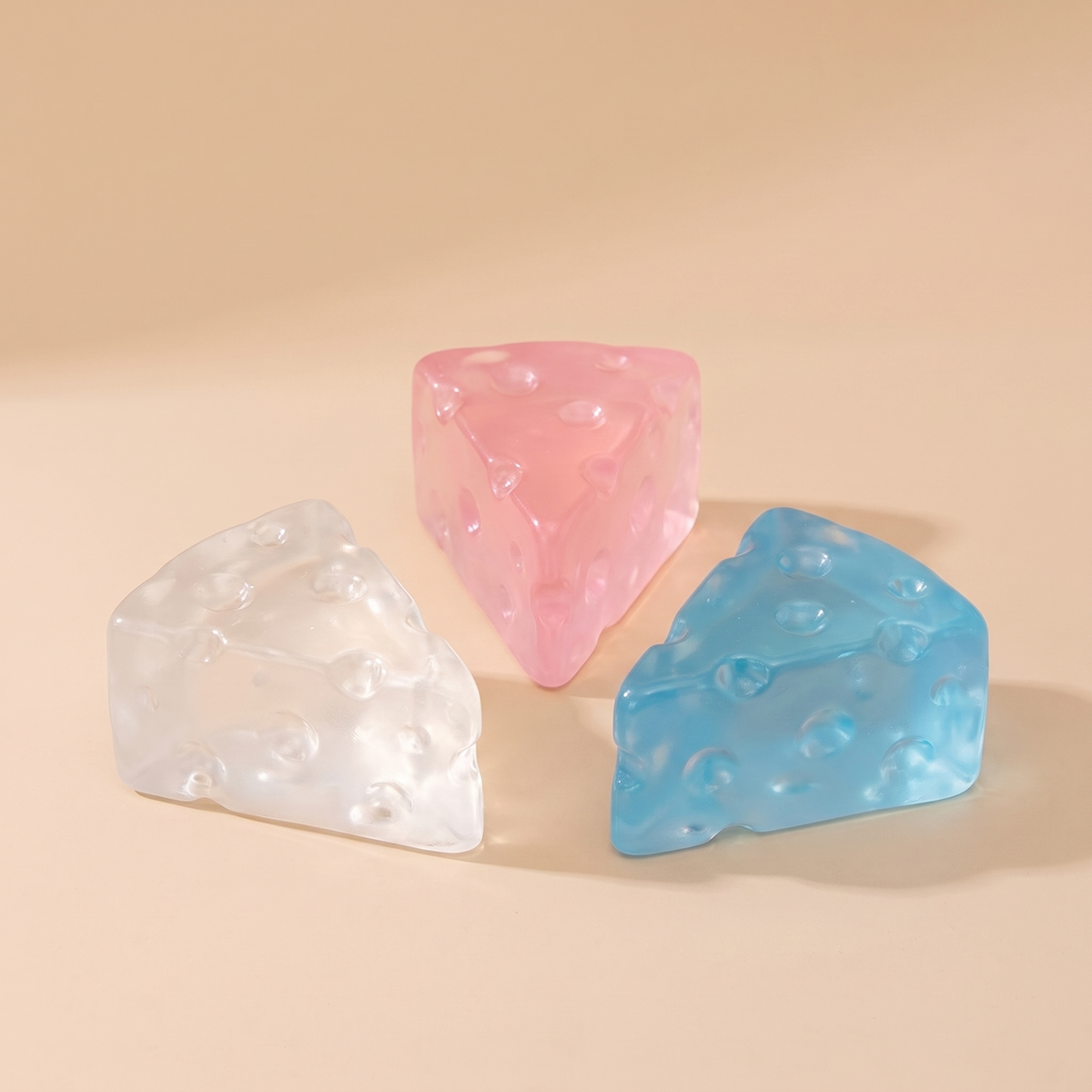 Slow rise squishy cheese fidget toys in clear, pink and blue