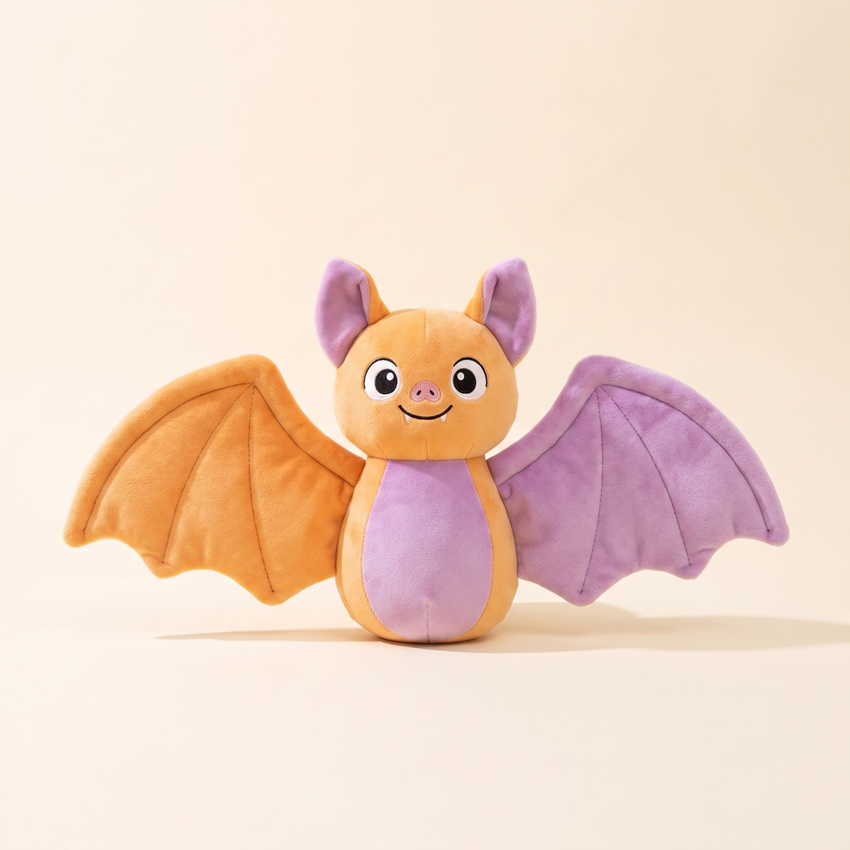 Cuddly bat cushion plush studio hero image